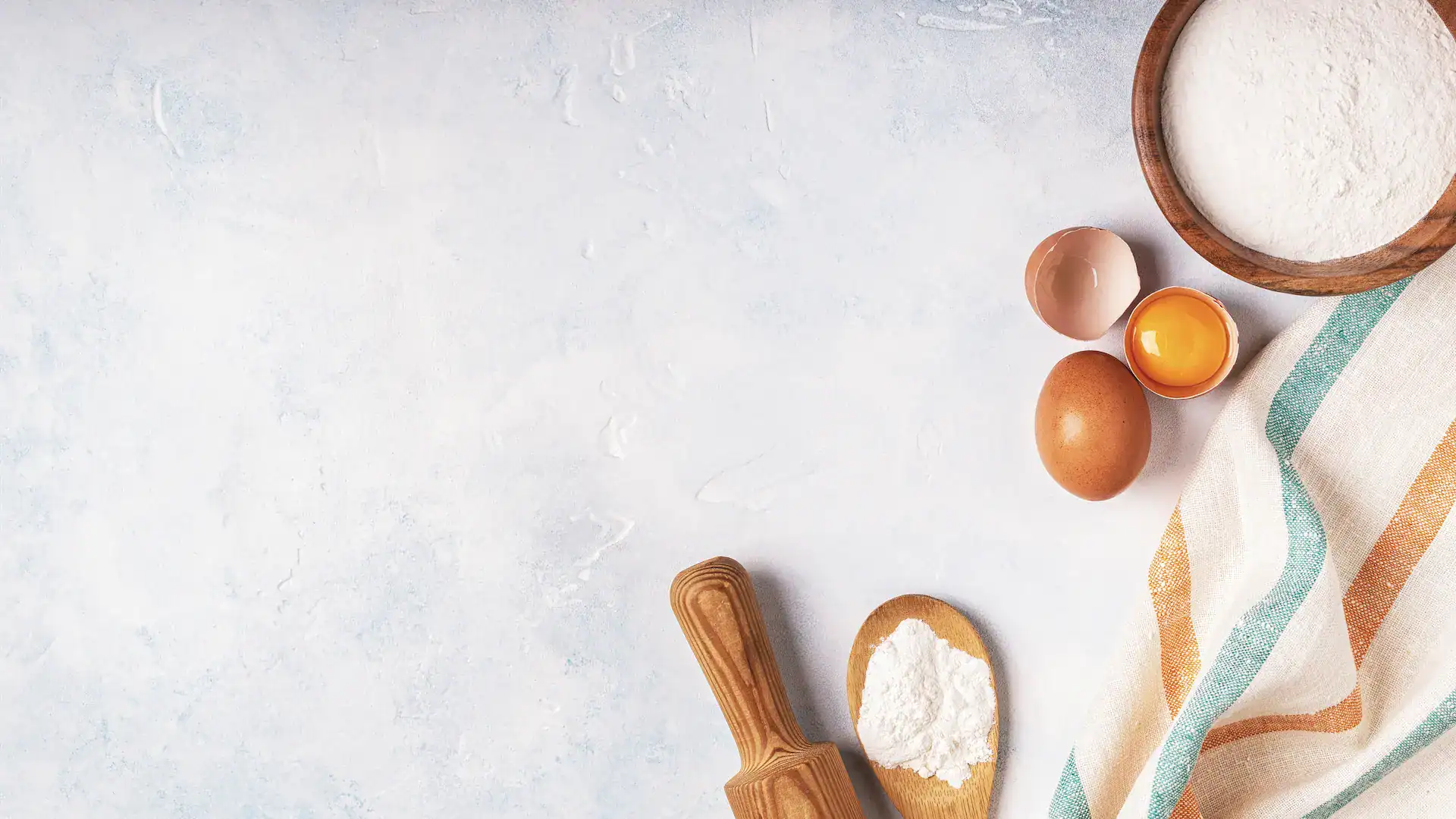 Baking flour and eggs on a table ready to be made into fresh homemade cookies in Garland, TX