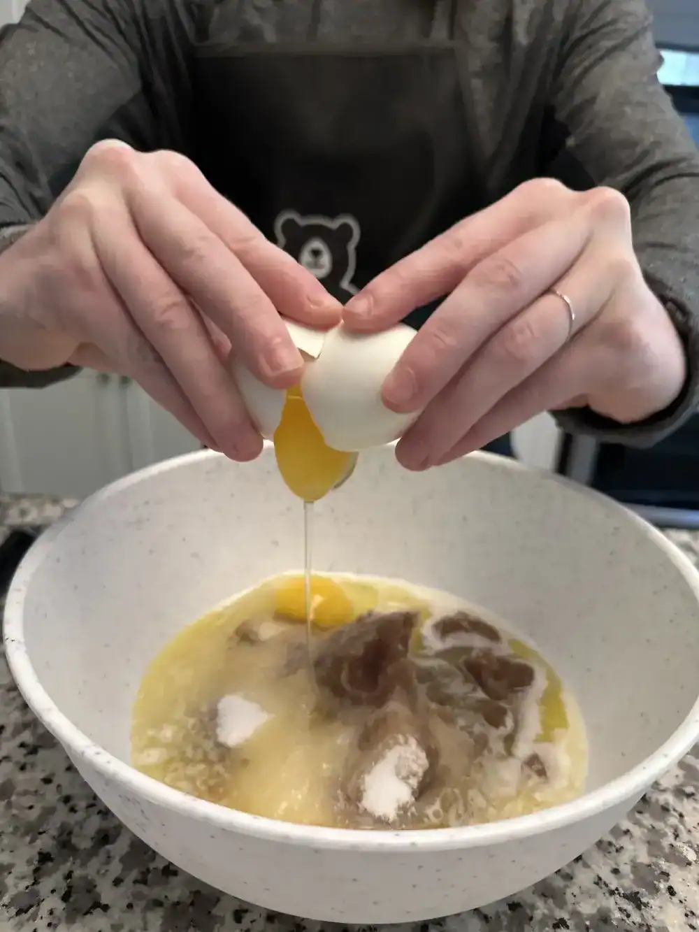 Sarah cracking an egg